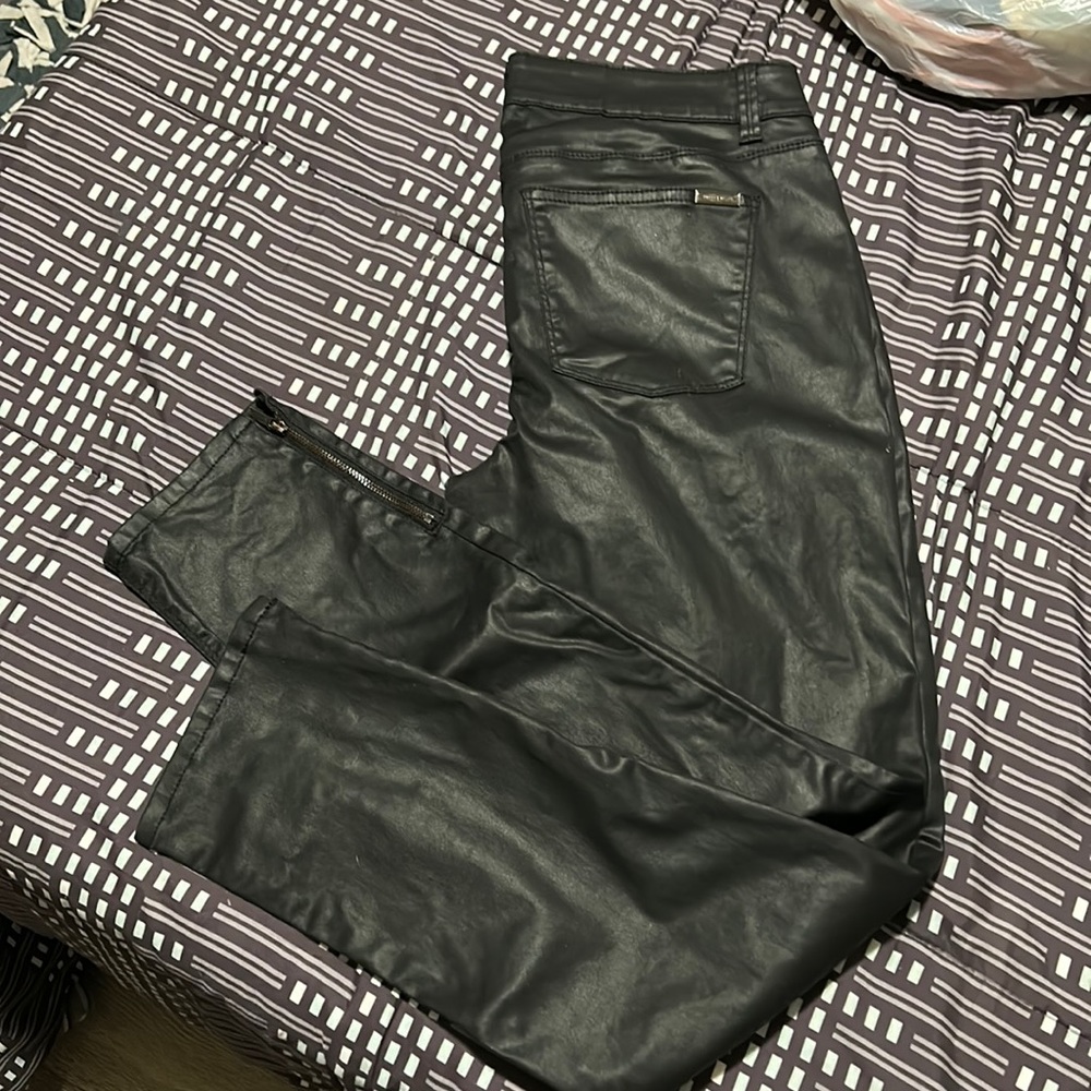 Woman’s black faux leather pants